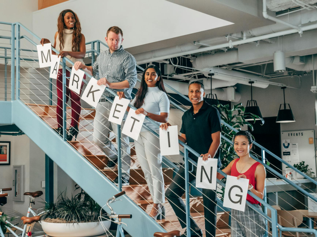 A photo of a diverse group of consumers engaging with a brand, symbolizing trust — data protection digital marketing Pen…