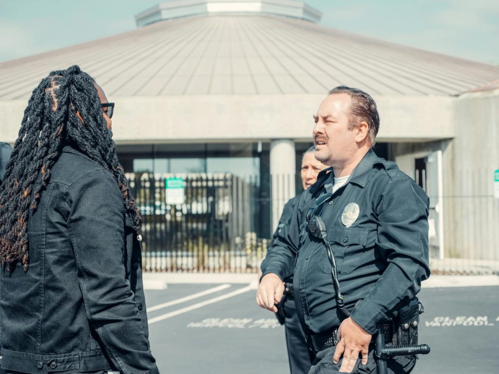 A police officer engaging with community members to promote witness cooperation Pennsylvania.