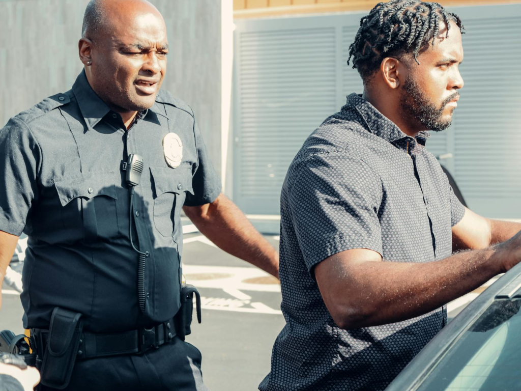 A police officer receiving a tip from a citizen about a crime. — PA Crime Stoppers success stories