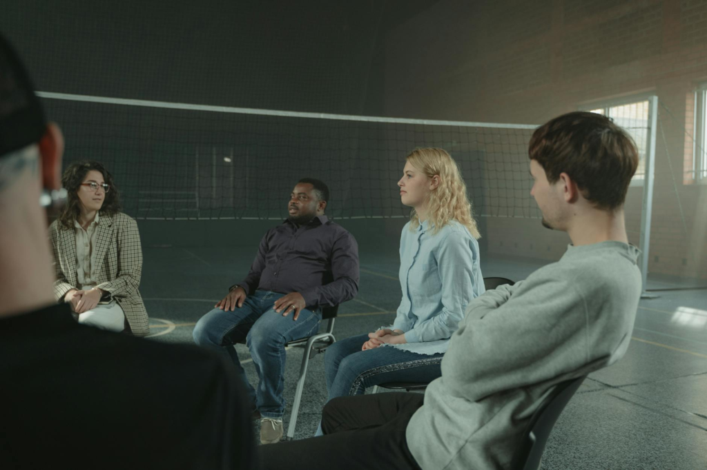 A supportive group session for witnesses discussing their experiences. — challenges for witnesses Pennsylvania