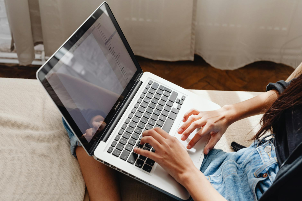 An image of a person researching charities on a laptop — ethics charitable giving