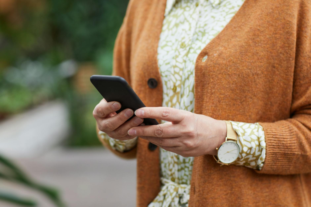 Image of a person using a phone to report a crime anonymously — report a crime anonymously Pennsylvania