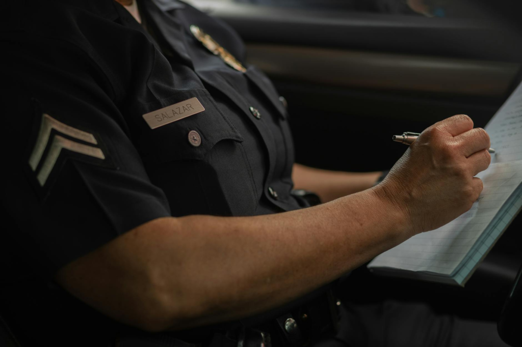 An image depicting a police officer receiving an anonymous tip related to how to report a crime anonymously in Pennsylvani…