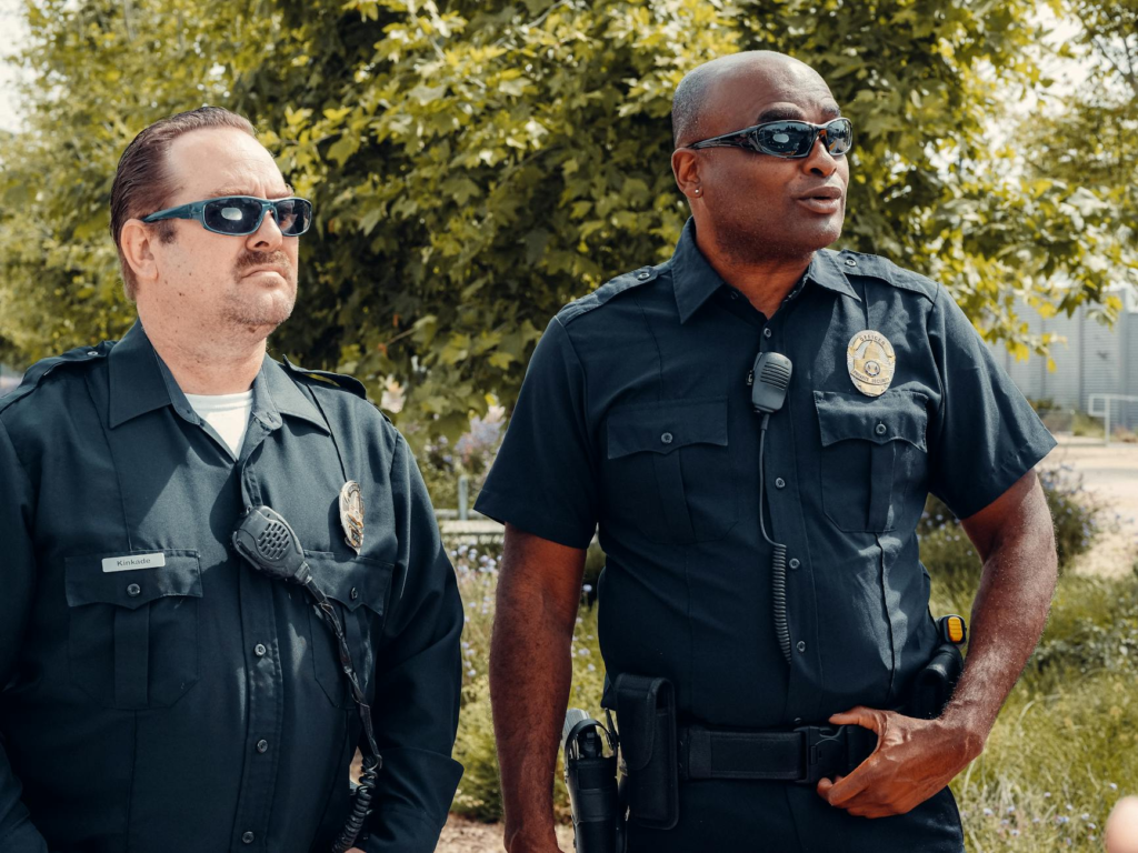An image of law enforcement officials collaborating with community members. — impact of PA Crime Stoppers