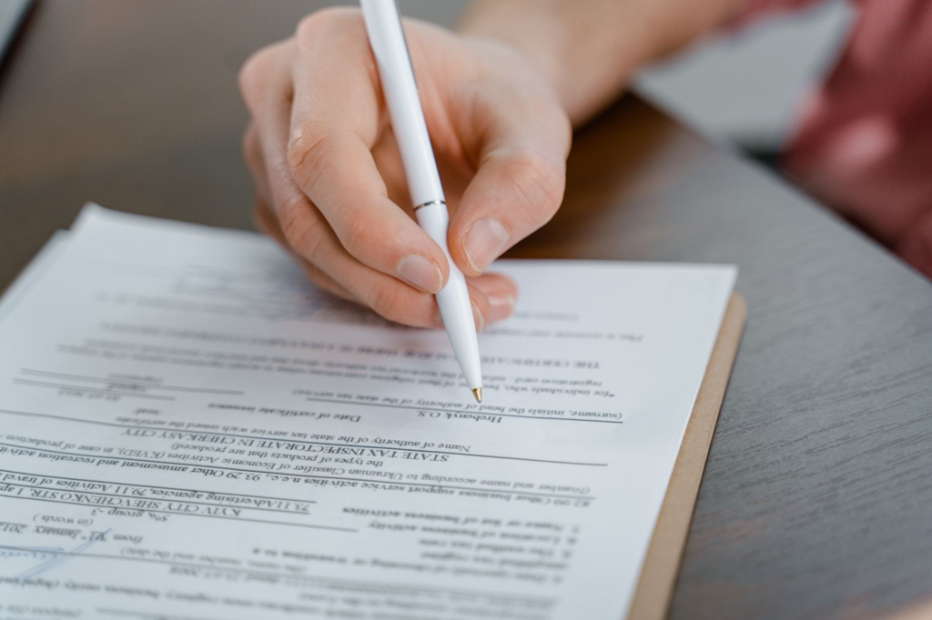 A close-up of a citizen filling out a tip form for Crime Stoppers. — Crime Stoppers success stories PA
