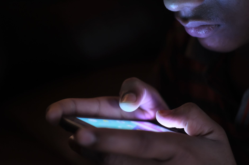 An image of a person using a smartphone to report a crime online. — reporting a crime anonymously PA