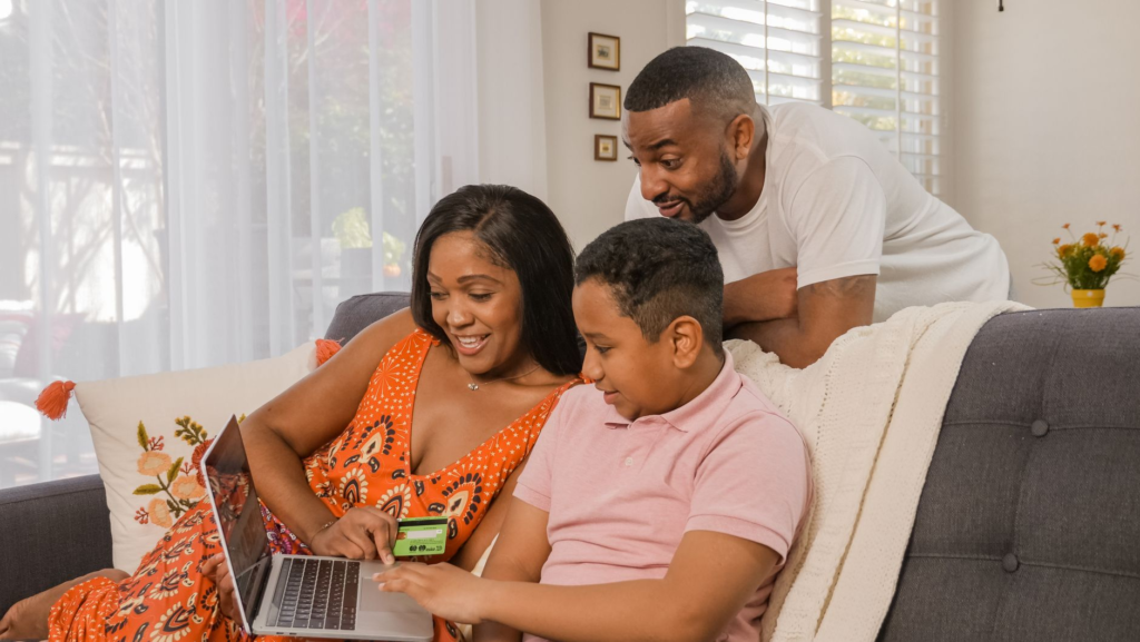 Image of a family using the internet safely at home — cybercrime pennsylvania