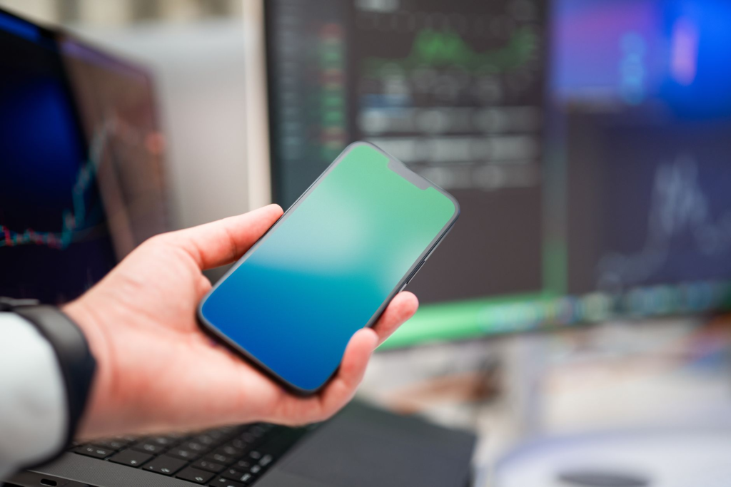 Image of a phone and computer showing how to report a crime online — FAQs PA Crime Stoppers