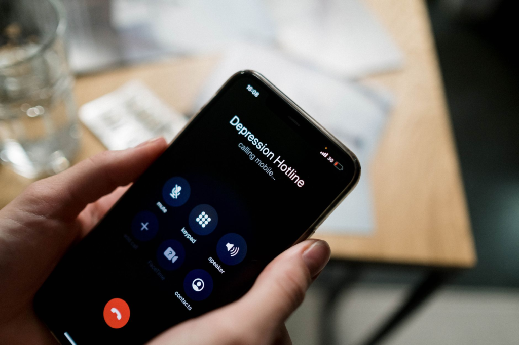 Image of a phone being used to call an anonymous tip hotline — report a crime anonymously Pennsylvania