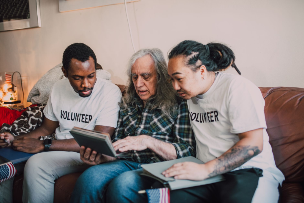 A close-up of a volunteer assisting community members with information about PA Crime Stoppers. — volunteer PA Crime Sto…