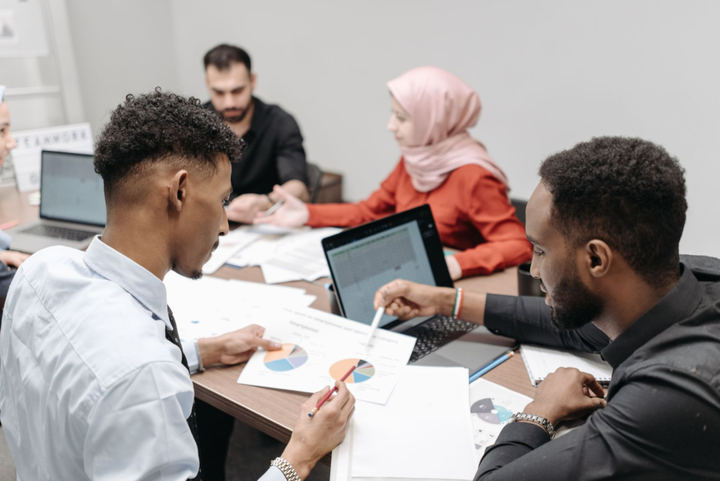 A photograph of a community meeting discussing crime prevention strategies, emphasizing the role of anonymous reporting psychology in fostering community collaboration.