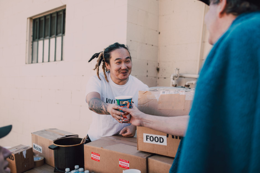 A smiling volunteer helping with outreach programs for PA Crime Stoppers. — get involved PA Crime Stoppers