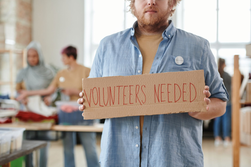 A volunteer helping a family in need, showcasing the community service aspect of Crime Stoppers. — Get involved with PA …