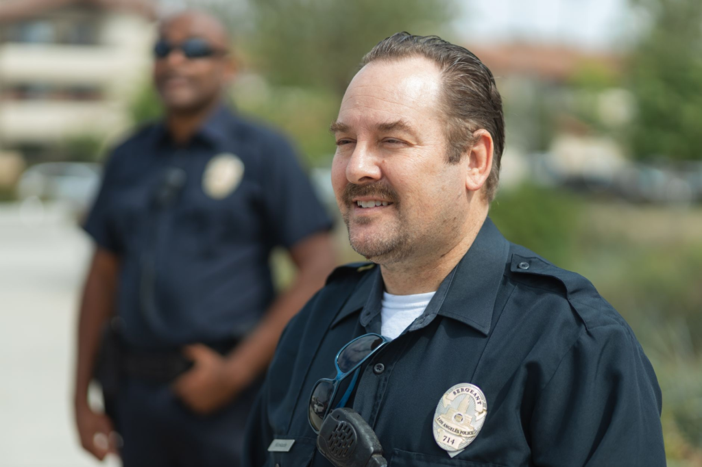 An image of police officers collaborating with community members, highlighting the role of PA Crime Stoppers in fostering community trust.