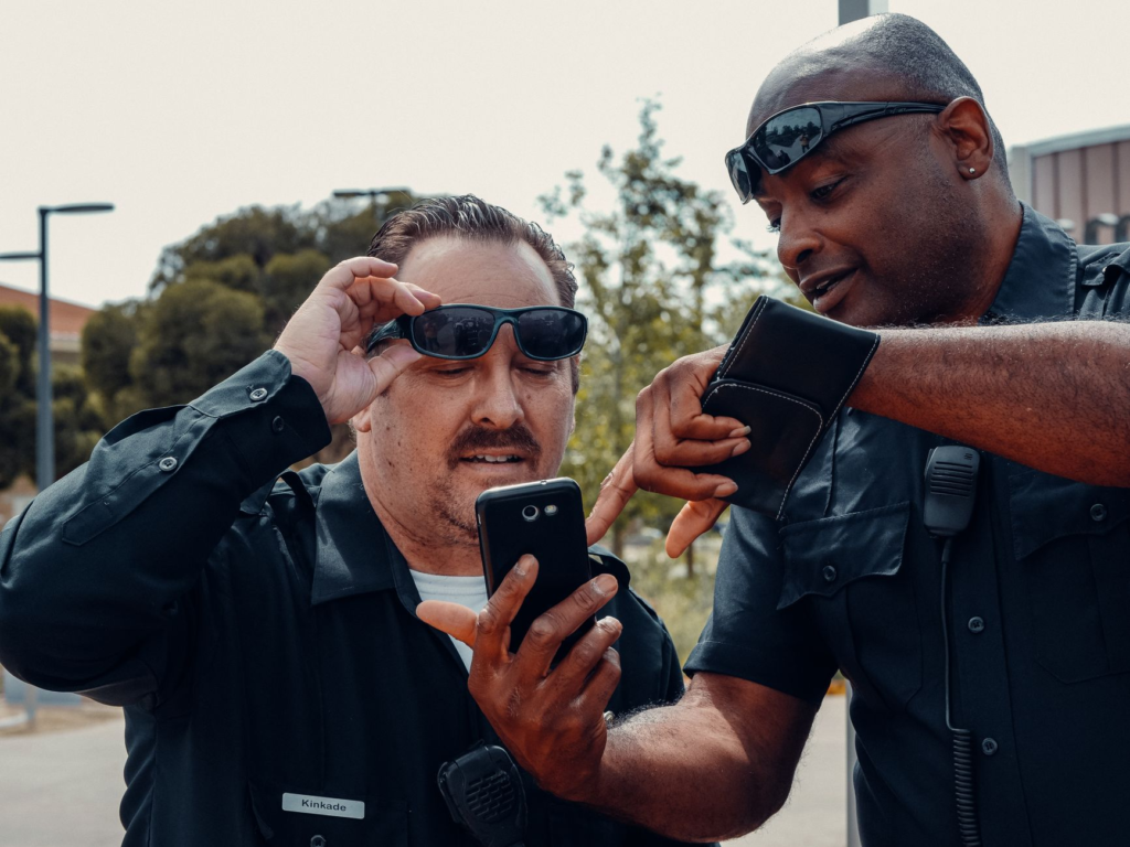 A photo of a local law enforcement officer receiving a tip from a community member, showcasing a PA Crime Stoppers success…
