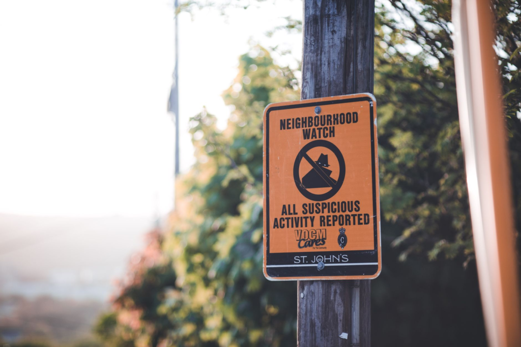 An image of a neighborhood watch sign promoting community safety using PA Crime Stoppers tips