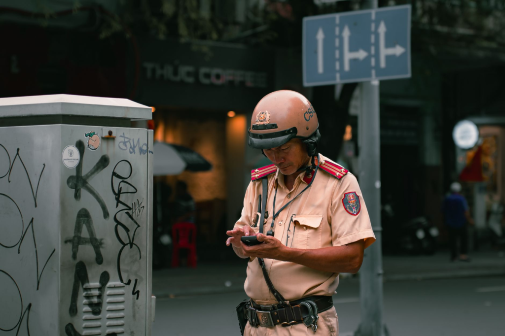 A photo of a police officer accepting an anonymous tip — legal protections crime reporting PA