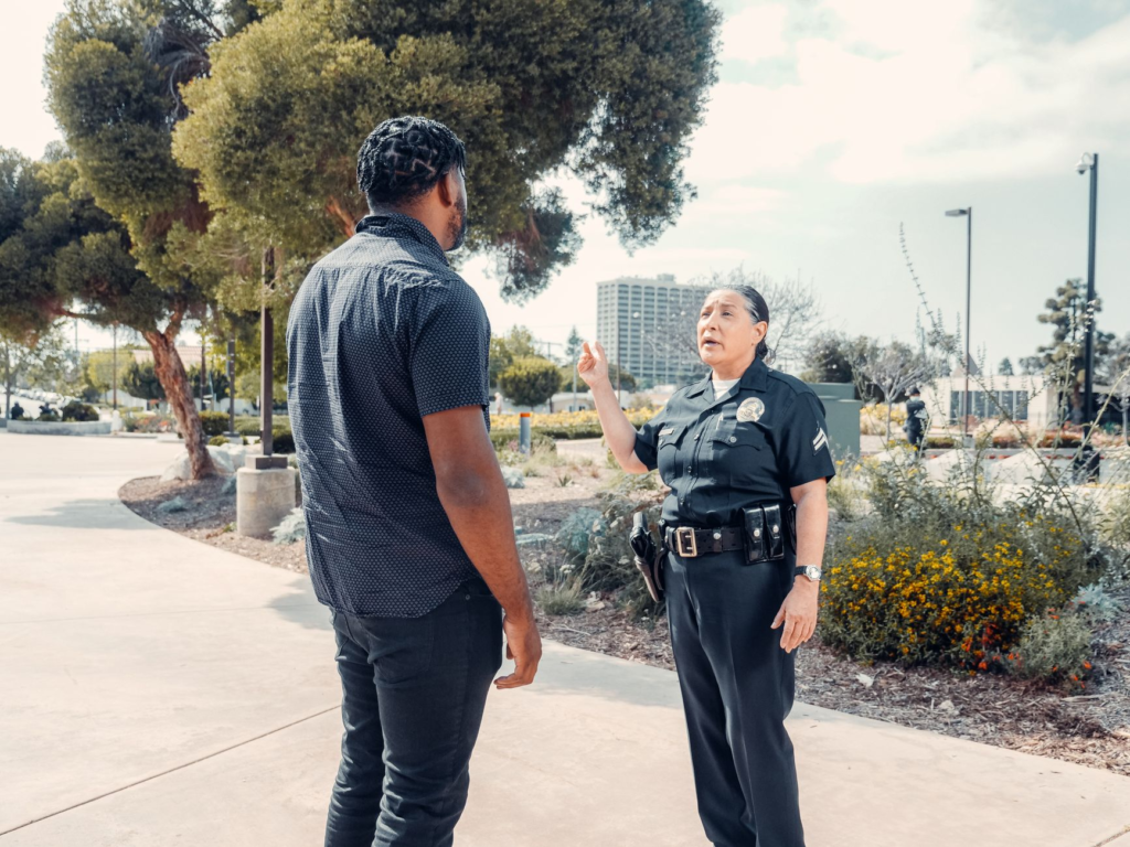 An image of a law enforcement officer discussing the importance of community tips — How PA Crime Stoppers works