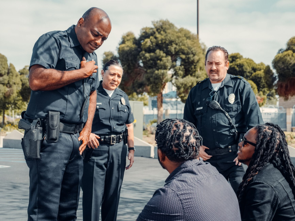An image of police officers collaborating with community members during an outreach program. — PA Crime Stoppers role in…